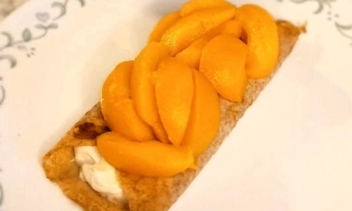 Cinnamon Crepes With Peaches and Cream Cheese